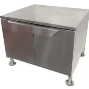 A professional-grade stainless steel combi oven stand featuring enclosed storage doors and a flat top